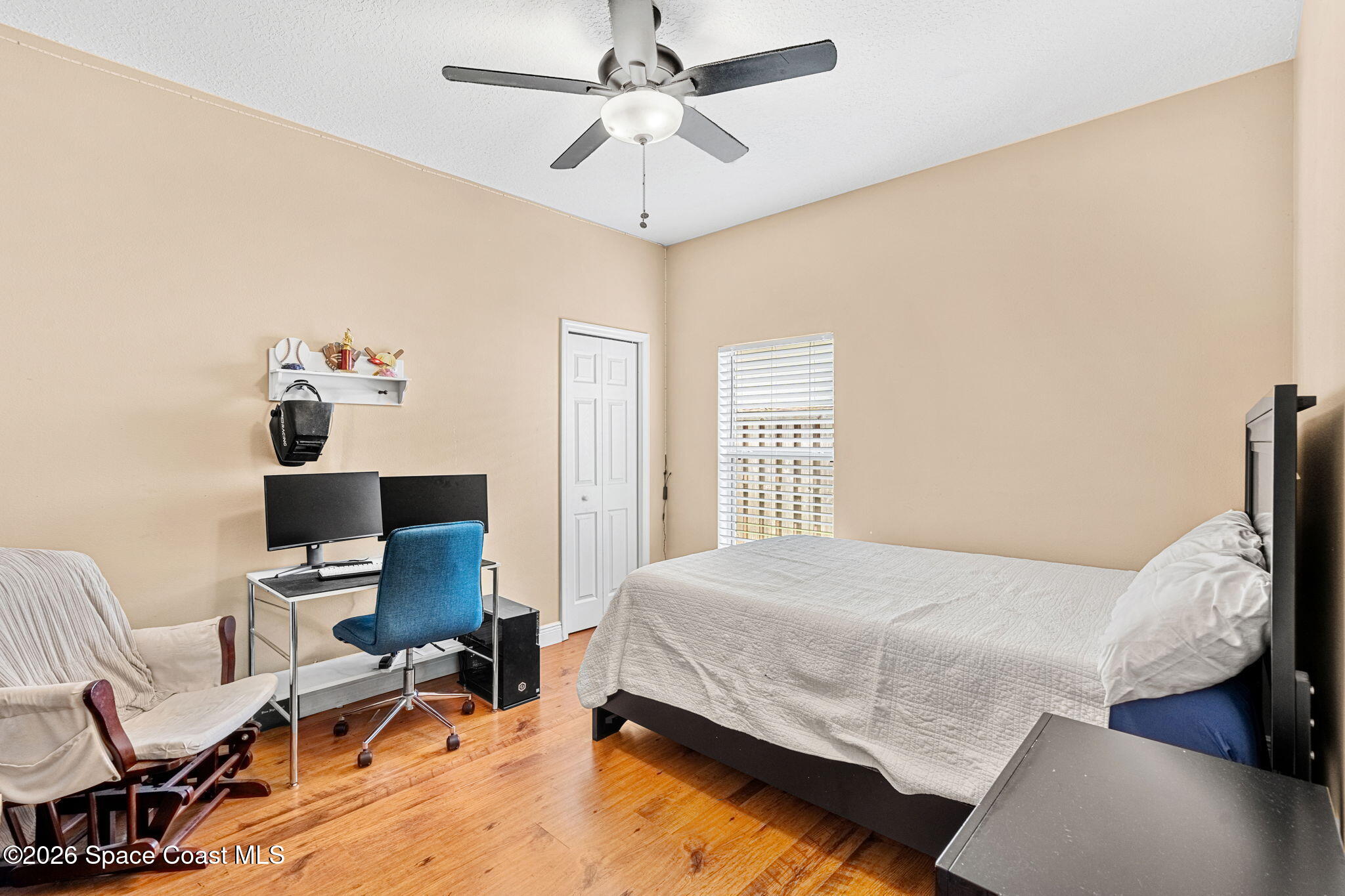 3751 Manitoba Way Rockledge, FL 32955 - Photo 37 of 64 a bedroom with a bed and furniture