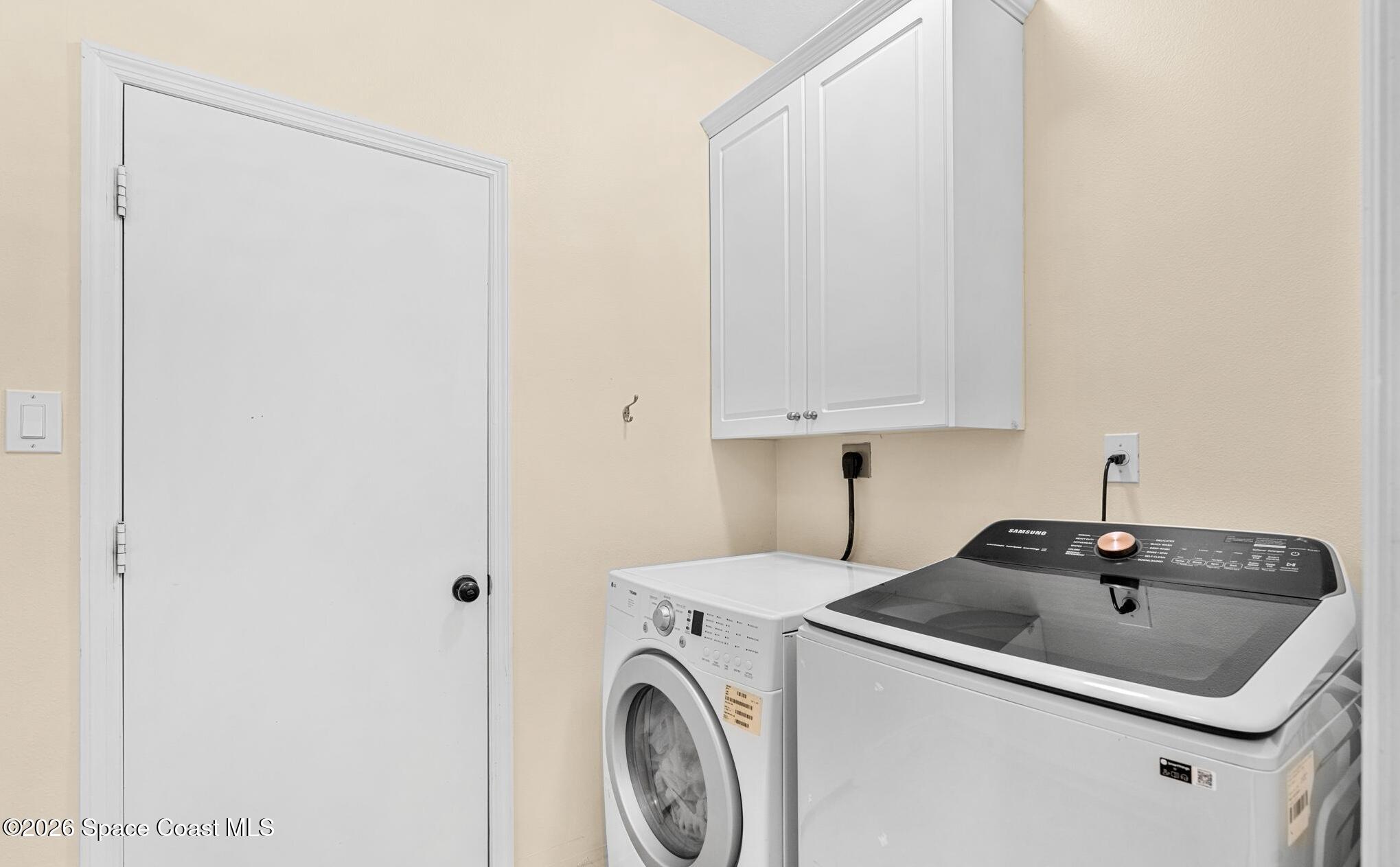 3751 Manitoba Way Rockledge, FL 32955 - Photo 39 of 64 a utility room with dryer and washer