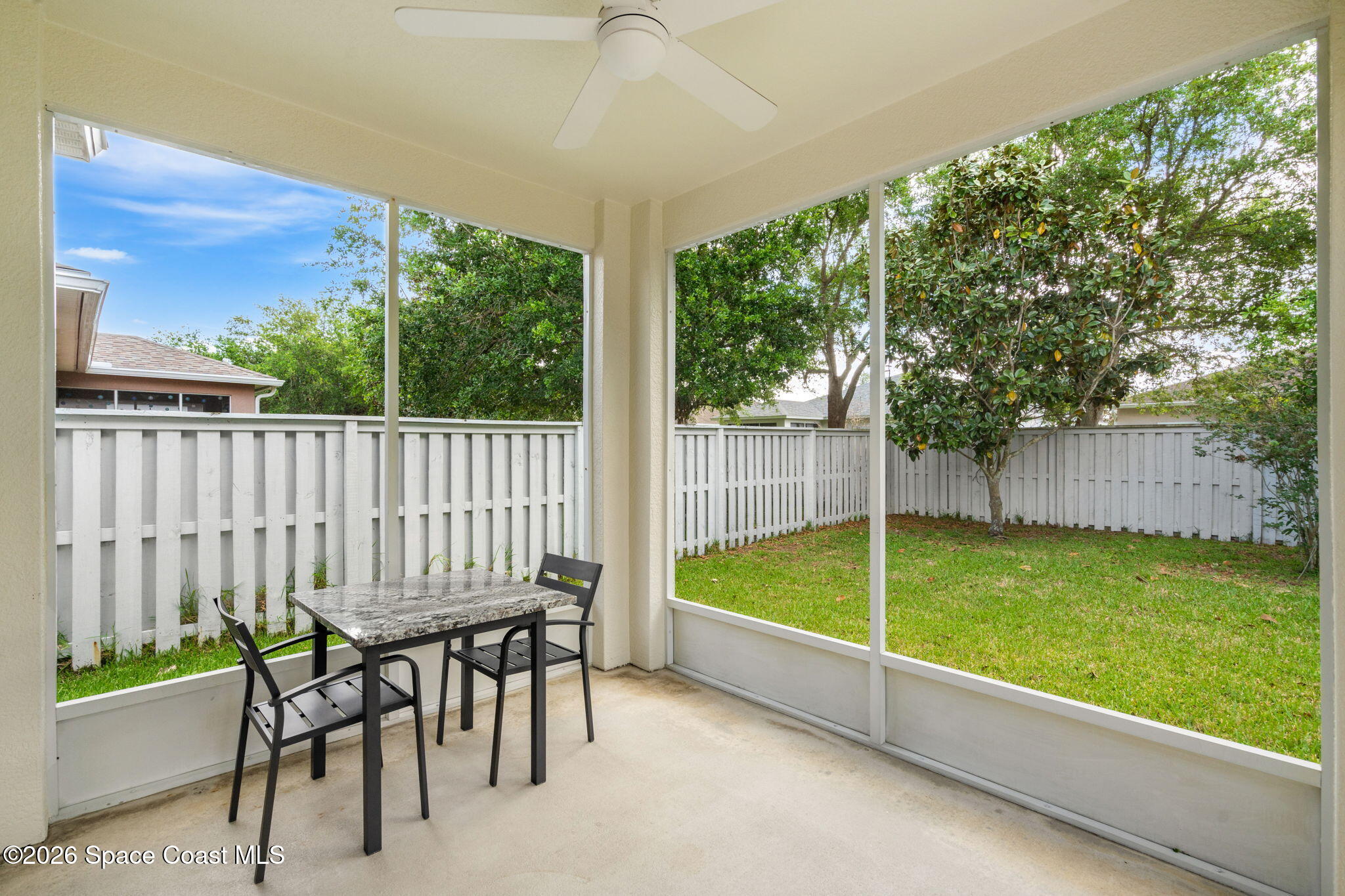 3751 Manitoba Way Rockledge, FL 32955 - Photo 47 of 64 a view of a chair and tables in the patio