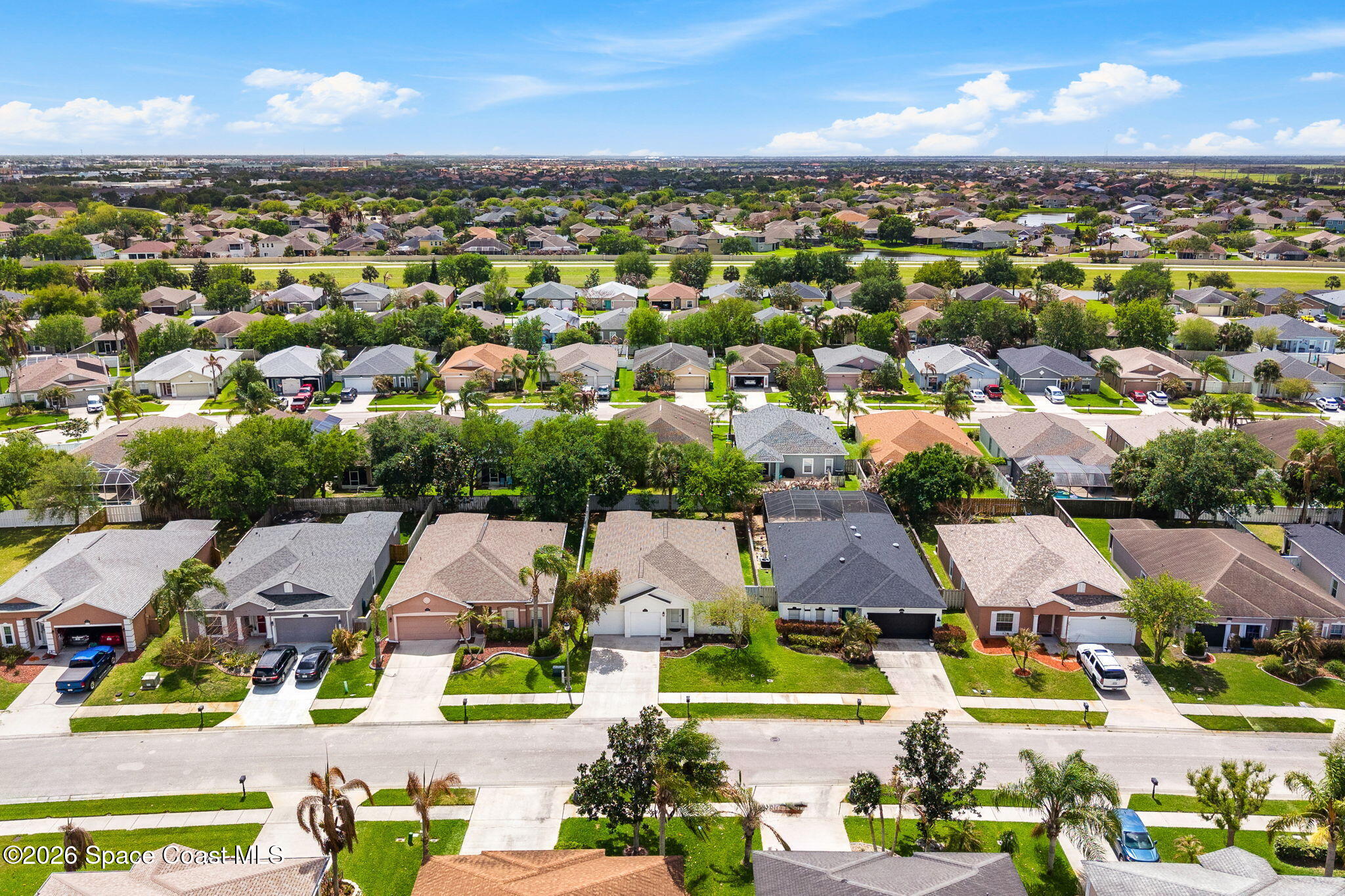 3751 Manitoba Way Rockledge, FL 32955 - Photo 58 of 64 an aerial view of residential houses with outdoor space and ocean view