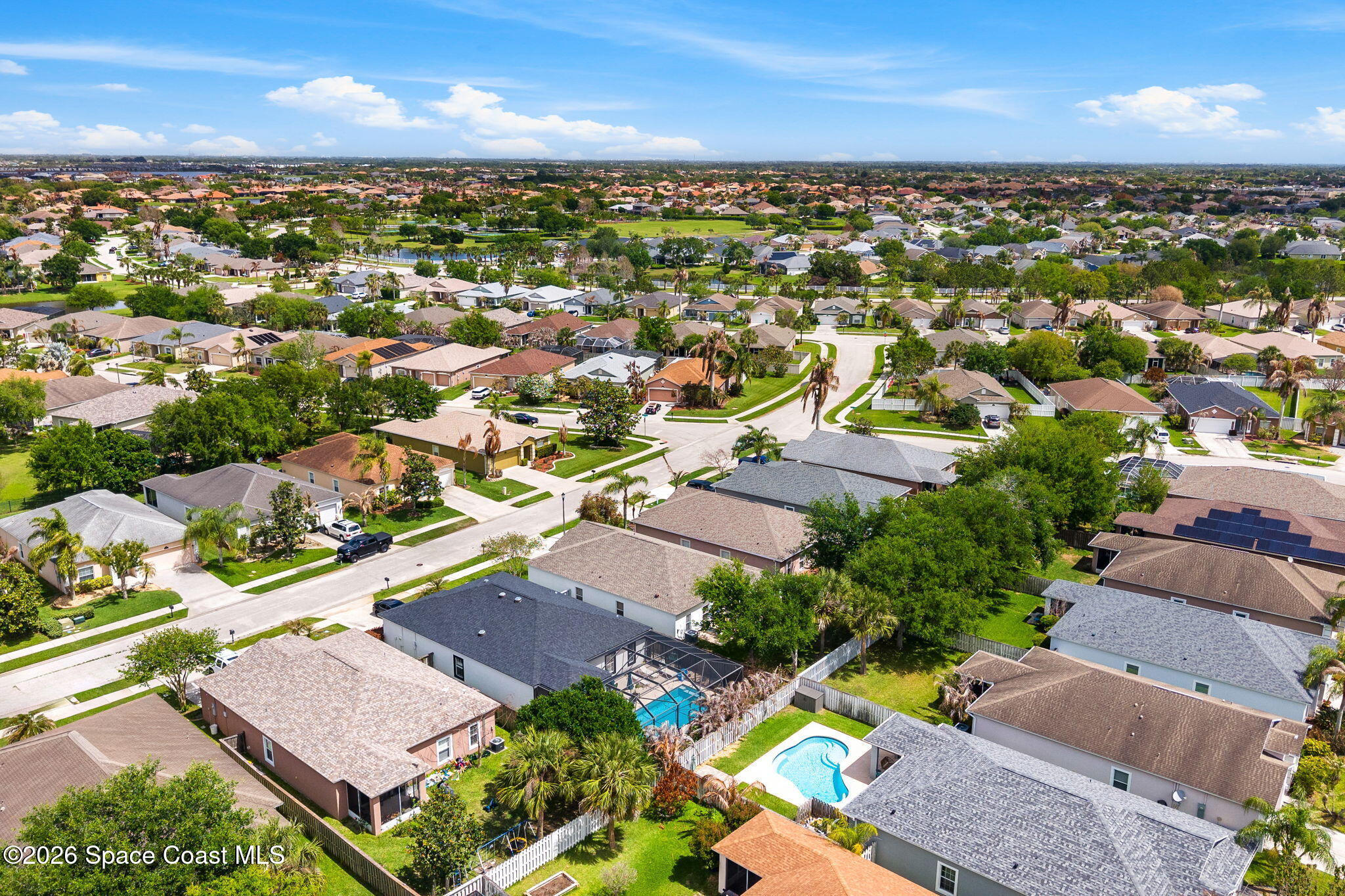 3751 Manitoba Way Rockledge, FL 32955 - Photo 60 of 64 an aerial view of residential houses with outdoor space and ocean view