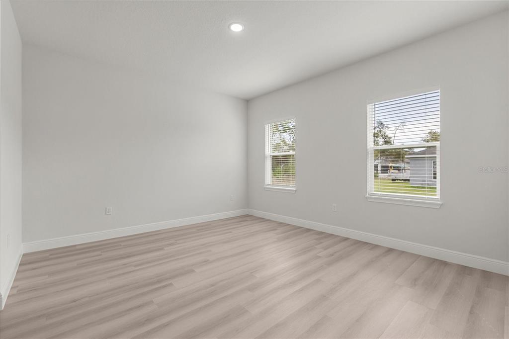 4016 Southwest 151st Street Ocala, FL 34473 - Photo 18 of 32 an empty room with windows