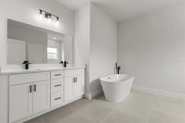 a bathroom with a double sink and a mirror