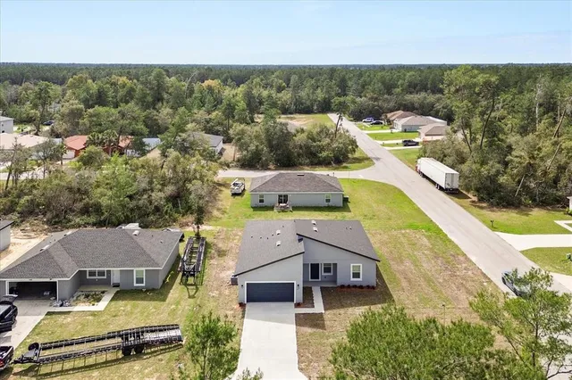 an aerial view of a house with a garden