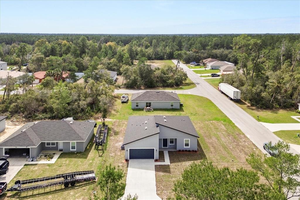 4016 Southwest 151st Street Ocala, FL 34473 - Photo 28 of 32 an aerial view of a house with a garden