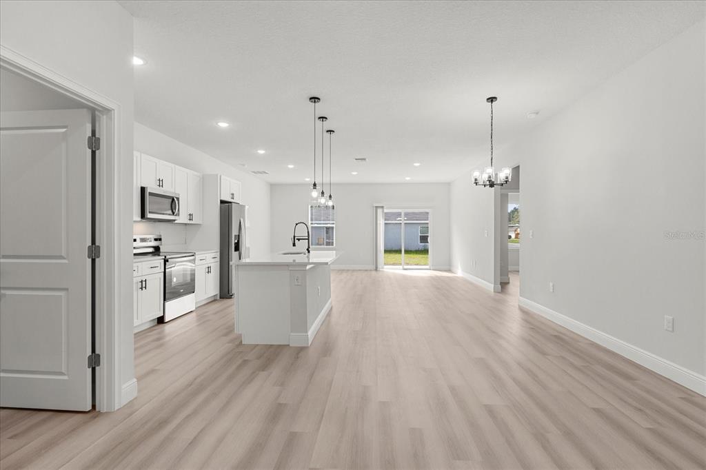 4016 Southwest 151st Street Ocala, FL 34473 - Photo 5 of 32 a view of a kitchen with wooden floor