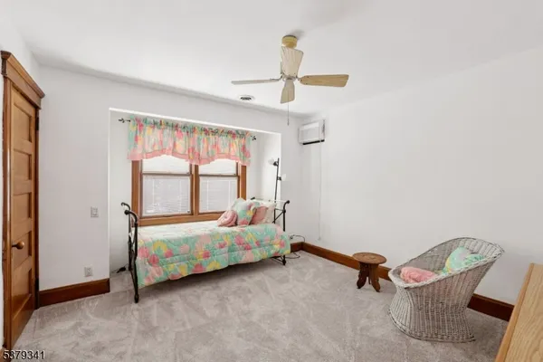 a room with a bed and a window