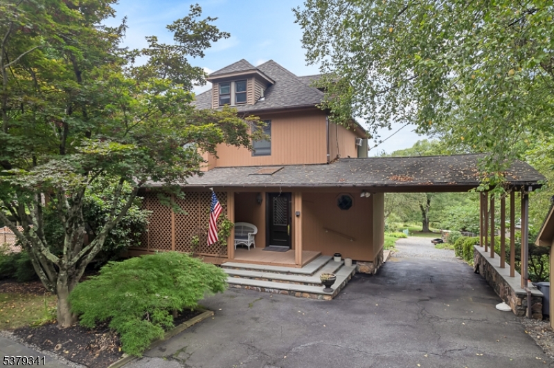 833 Berkshire Valley Road Wharton, NJ 07885 - Photo 2 of 48 a view of a house with porch and garden