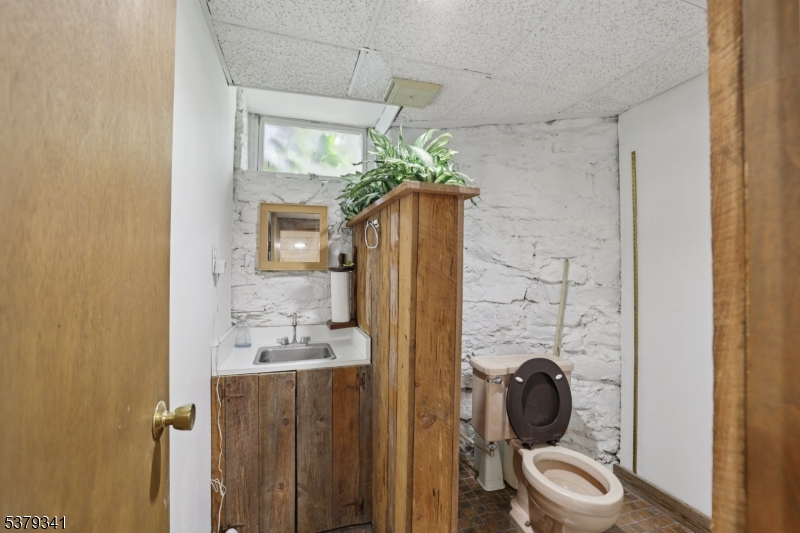 833 Berkshire Valley Road Wharton, NJ 07885 - Photo 24 of 48 a bathroom with a granite countertop sink a mirror and shower