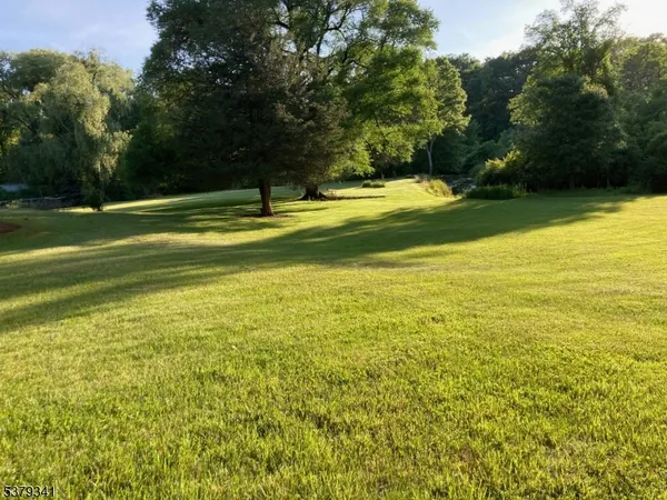 a view of a lake with a yard