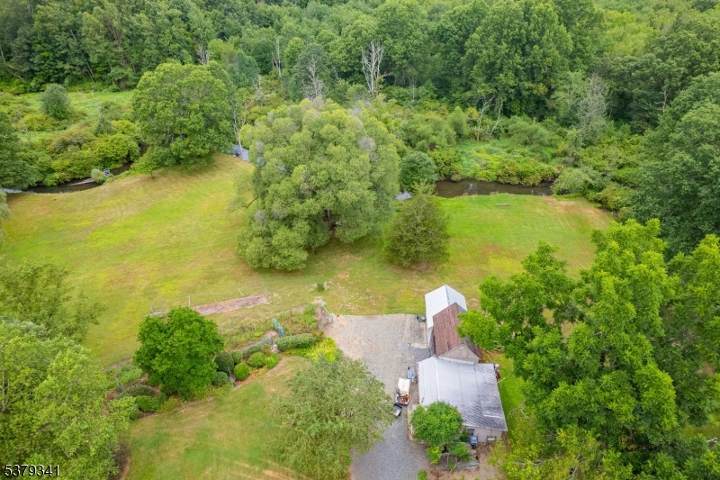 833 Berkshire Valley Road Wharton, NJ 07885 - Photo 39 of 48 an aerial view of a house with a yard and lake view