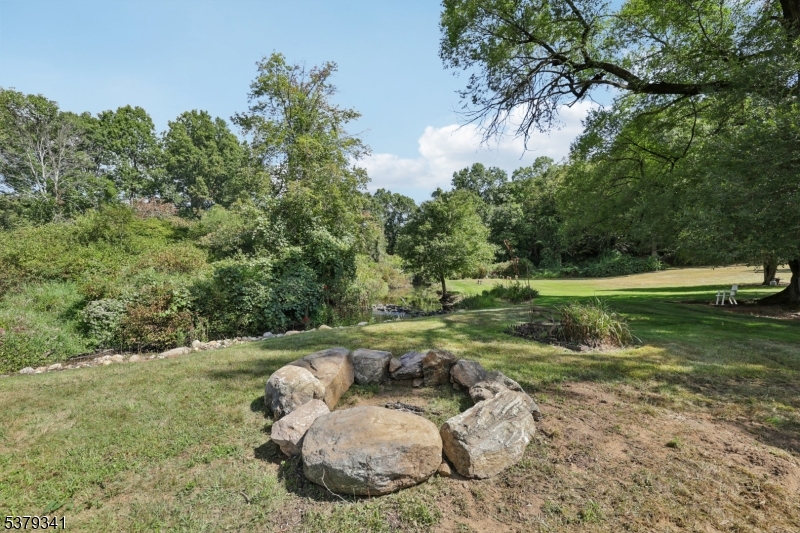 833 Berkshire Valley Road Wharton, NJ 07885 - Photo 43 of 48 a backyard of a house with a yard and outdoor seating