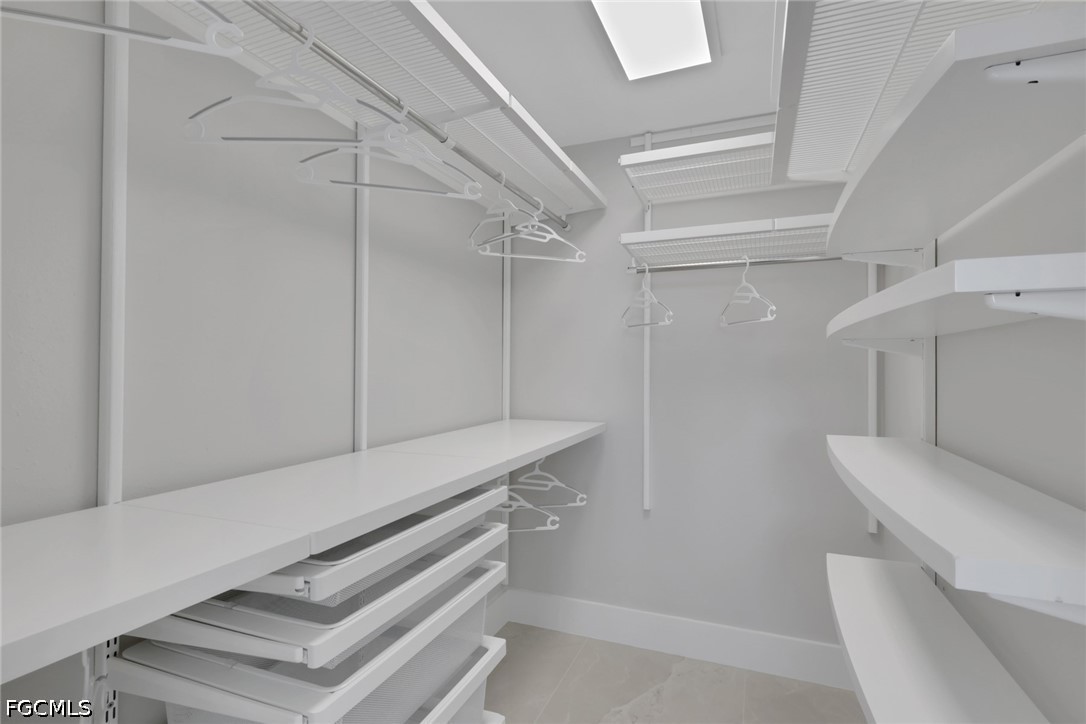 9 High Point Circle North, Unit 101 Naples, FL 34103 - Photo 26 of 49 a view of an empty walk in closet