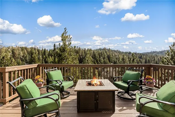 a view of a balcony with furniture
