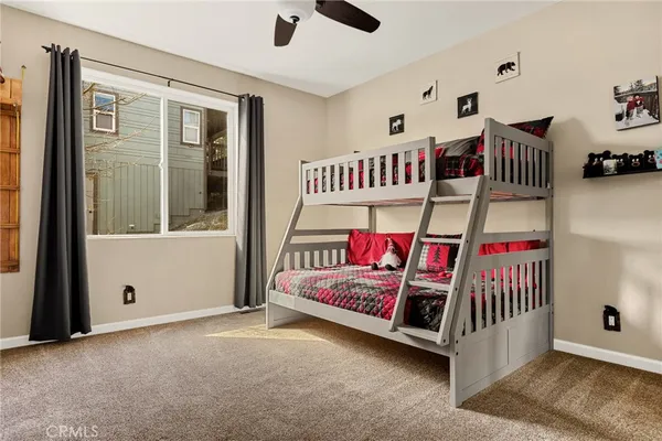 a bedroom with furniture and a window