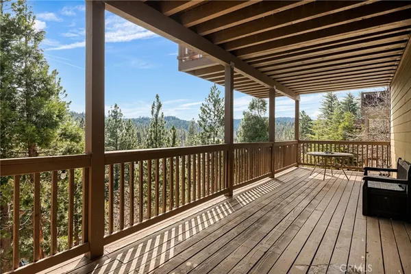 a view of balcony with wooden floor