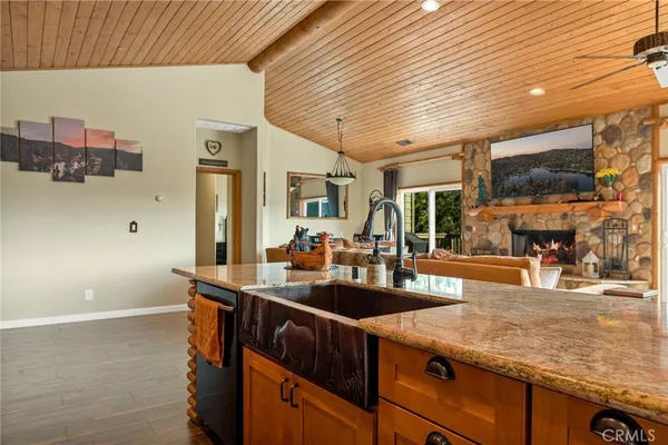 a kitchen with sink stove and cabinets