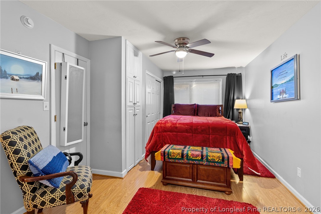 1912 Havilah Road Fayetteville, NC 28303 - Photo 8 of 14 a bedroom with a bed and wooden floor