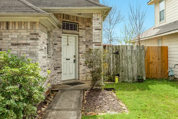 a view of a pathway of a house with backyard