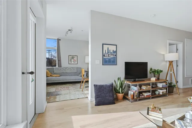 a view of a livingroom with furniture and a flat screen tv