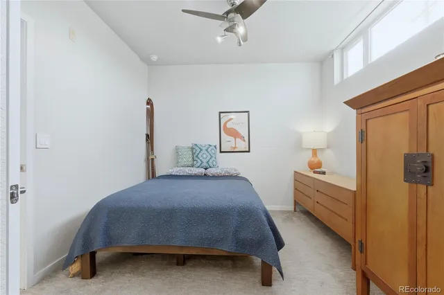 a bedroom with a bed and a table