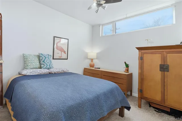 a bedroom with a bed and a table