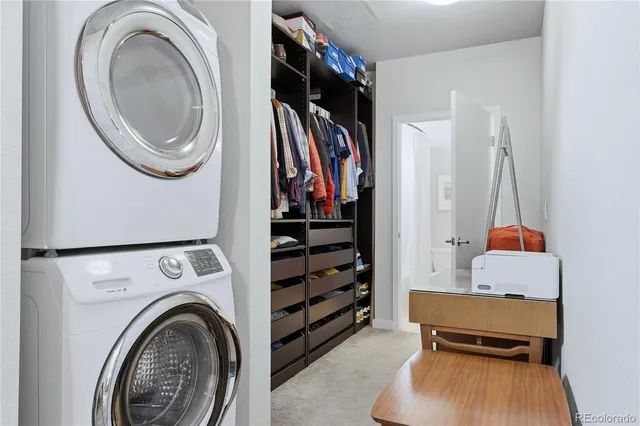 a view of a bedroom with washer and dryer