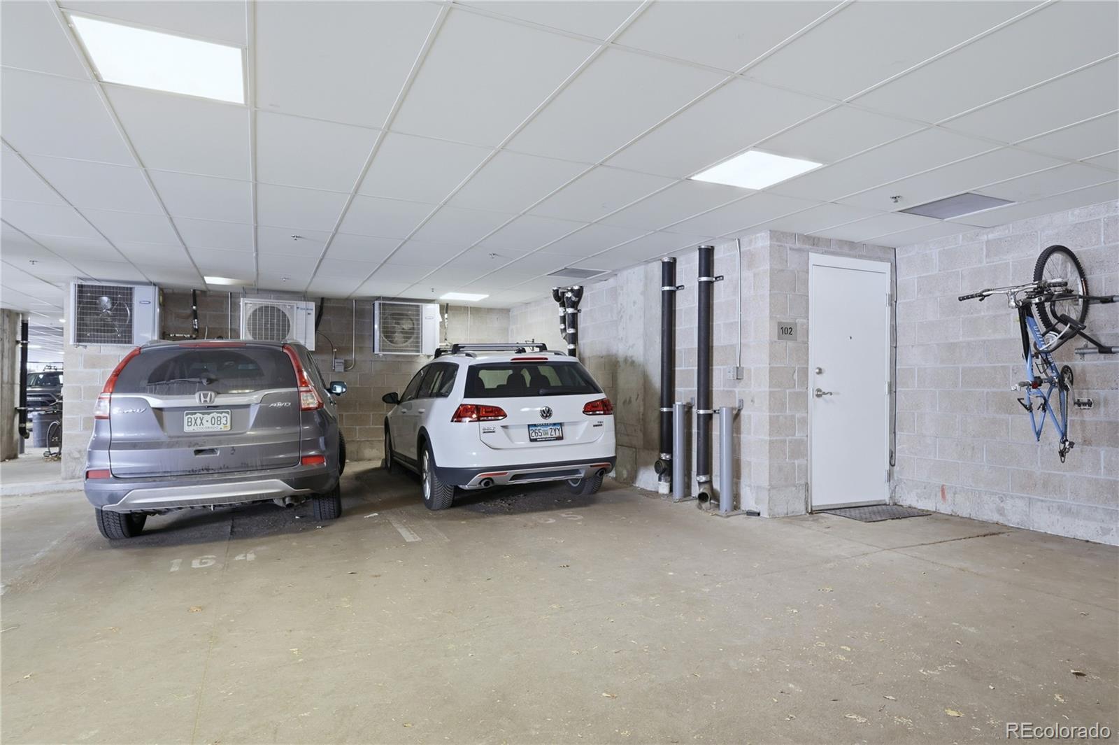 3101 Blake Street, Unit 201 Denver, CO 80205 - Photo 25 of 29 a bedroom with furniture and a window