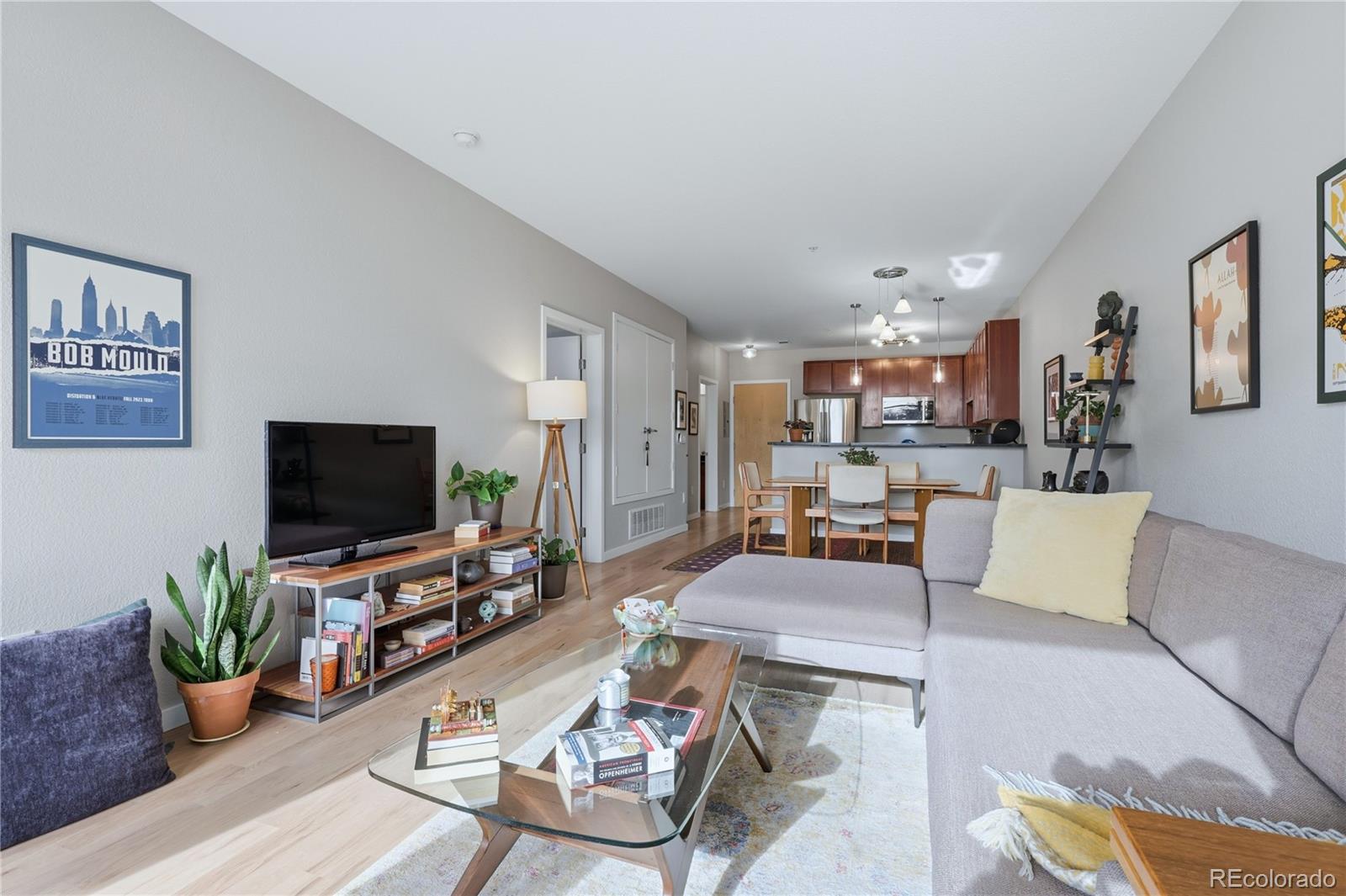 3101 Blake Street, Unit 201 Denver, CO 80205 - Photo 4 of 29 a living room with furniture and a flat screen tv