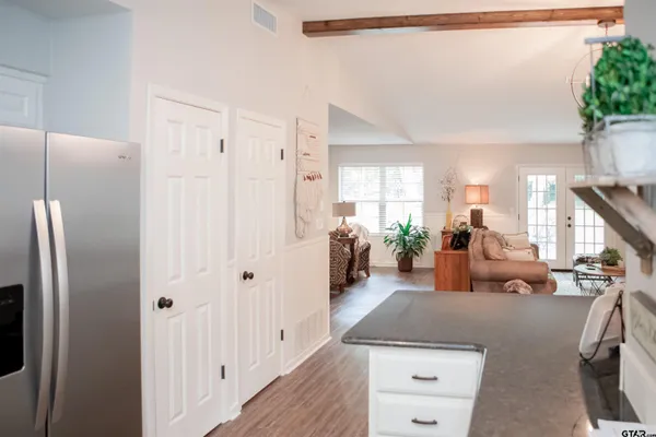 a very nice looking room with a large window and couch