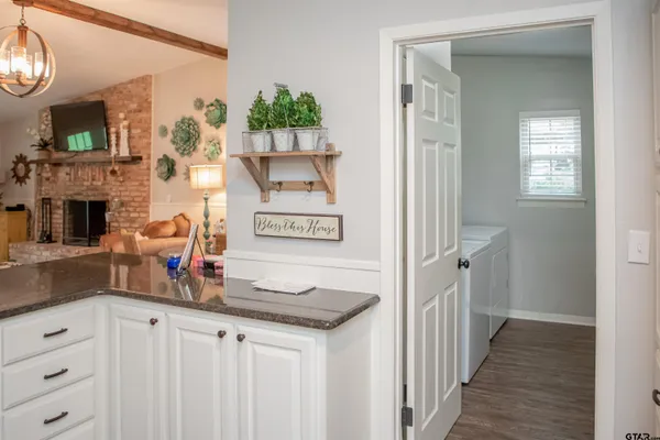a view of a kitchen from the hallway