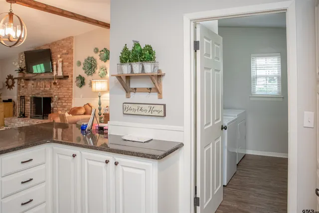 a view of a kitchen from the hallway
