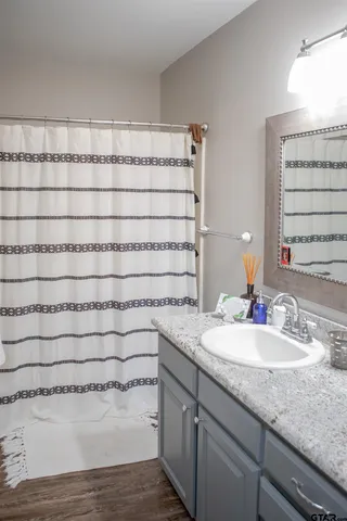 a bathroom with a sink and a mirror