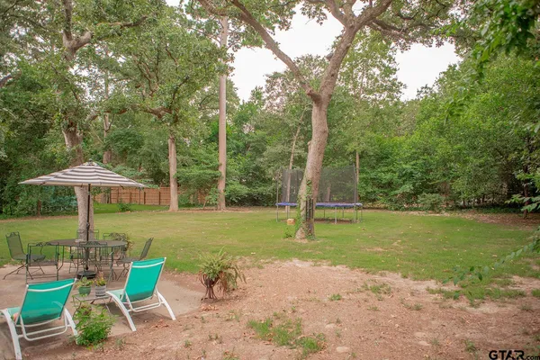 a view of a patio with furniture