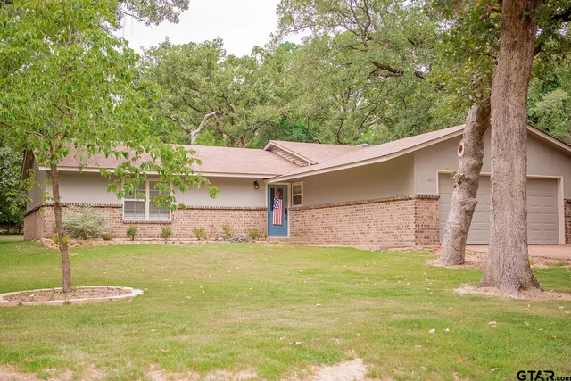 a view of a house with pool and a yard