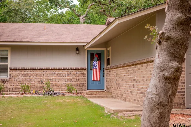 a front view of a house with an outdoor space