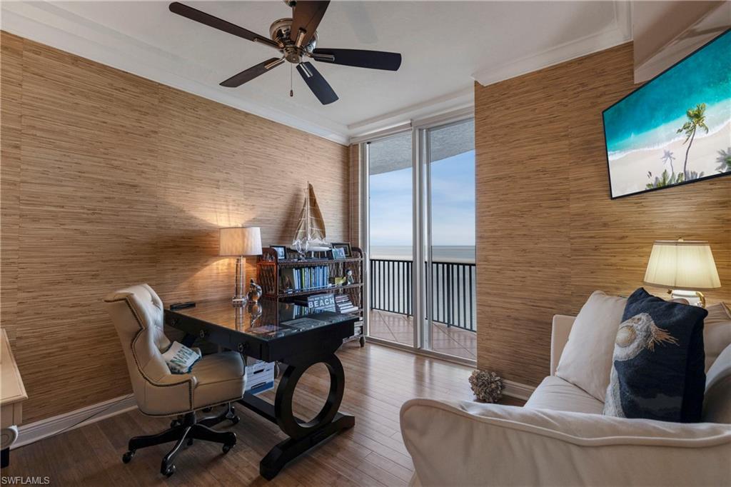 700 La Peninsula Boulevard, Unit 404 Naples, FL 34113 - Photo 30 of 43 a living room with furniture and a flat screen tv