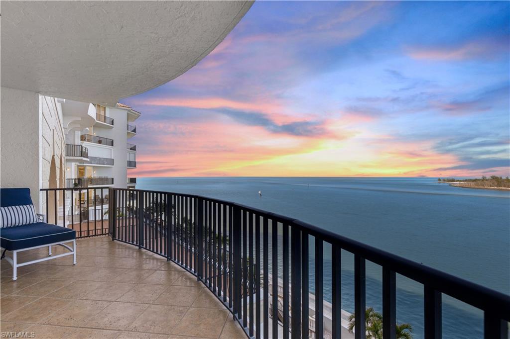 700 La Peninsula Boulevard, Unit 404 Naples, FL 34113 - Photo 3 of 43 a balcony with wooden floor and city view