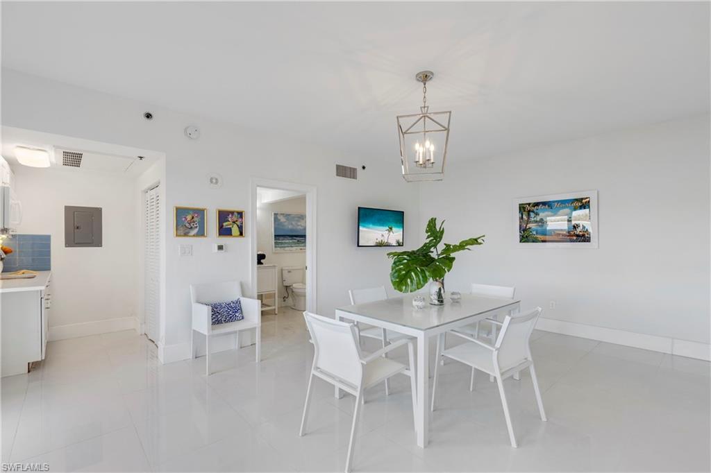 700 La Peninsula Boulevard, Unit 404 Naples, FL 34113 - Photo 34 of 43 a dining room with furniture and window