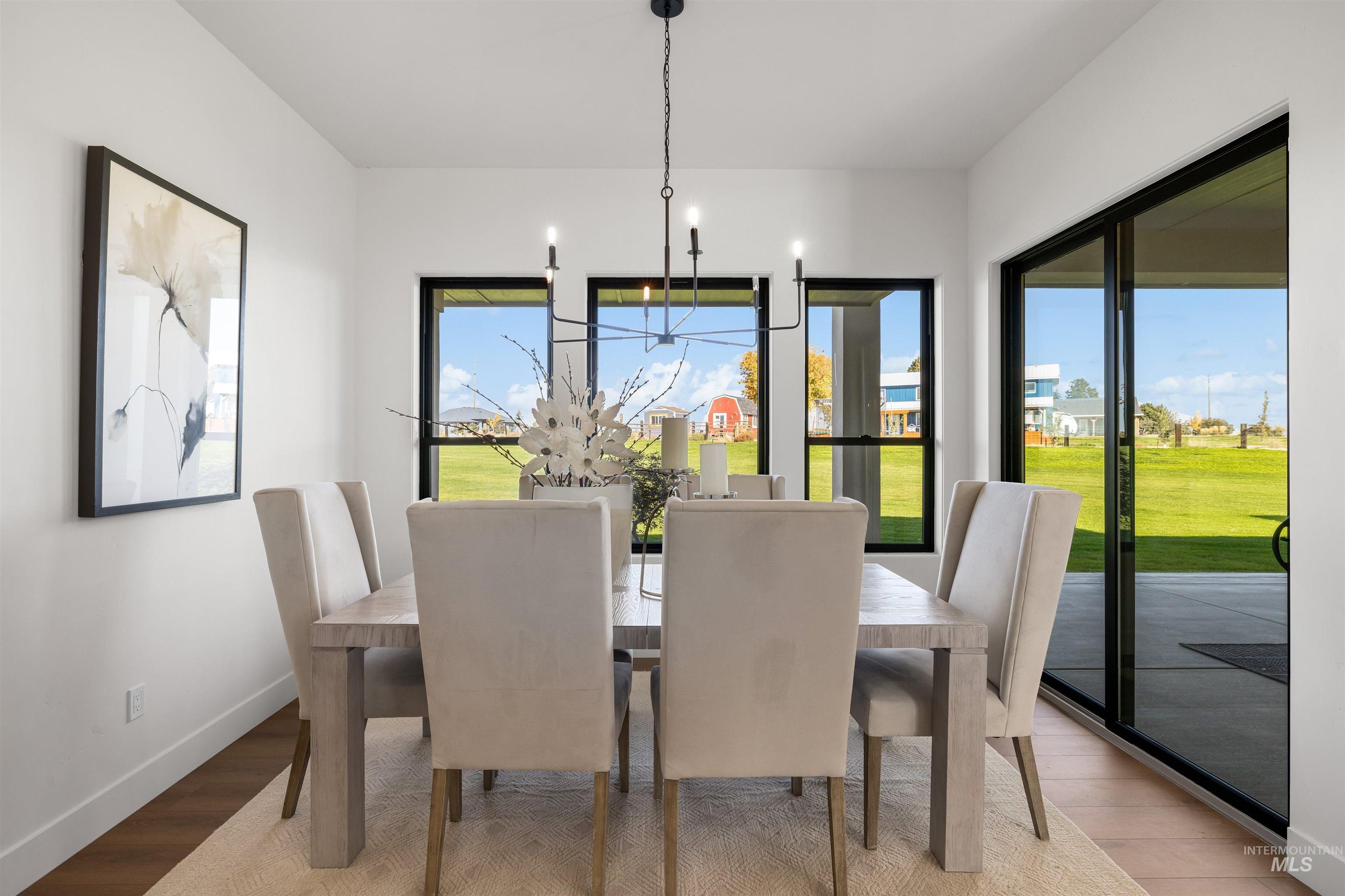 25403 Bur Oak Place Caldwell, ID 83607 - Photo 19 of 46 Dining space with light wood-style floors and baseboards