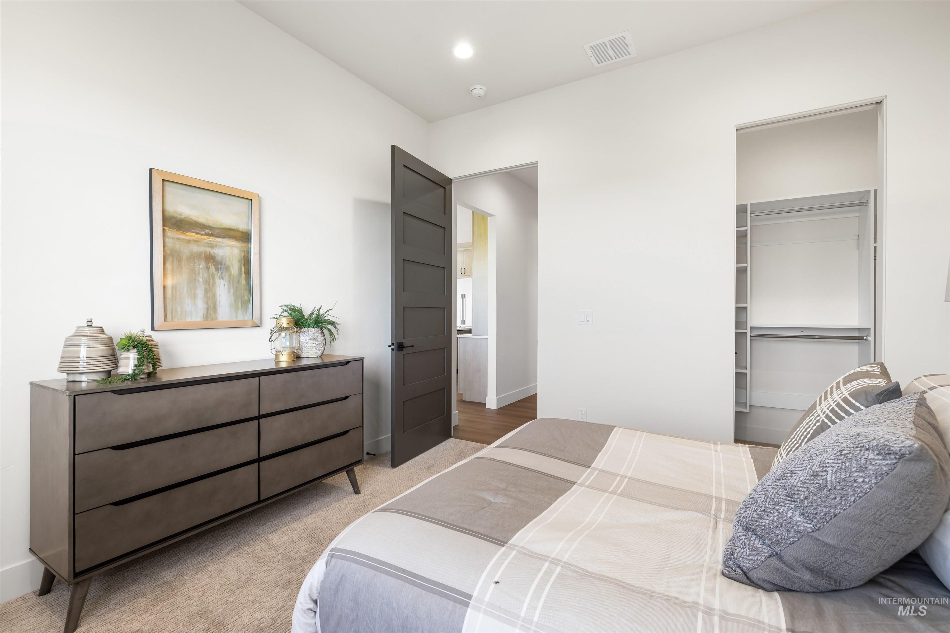 25403 Bur Oak Place Caldwell, ID 83607 - Photo 30 of 46 Bedroom featuring carpet, a spacious closet, and recessed lighting