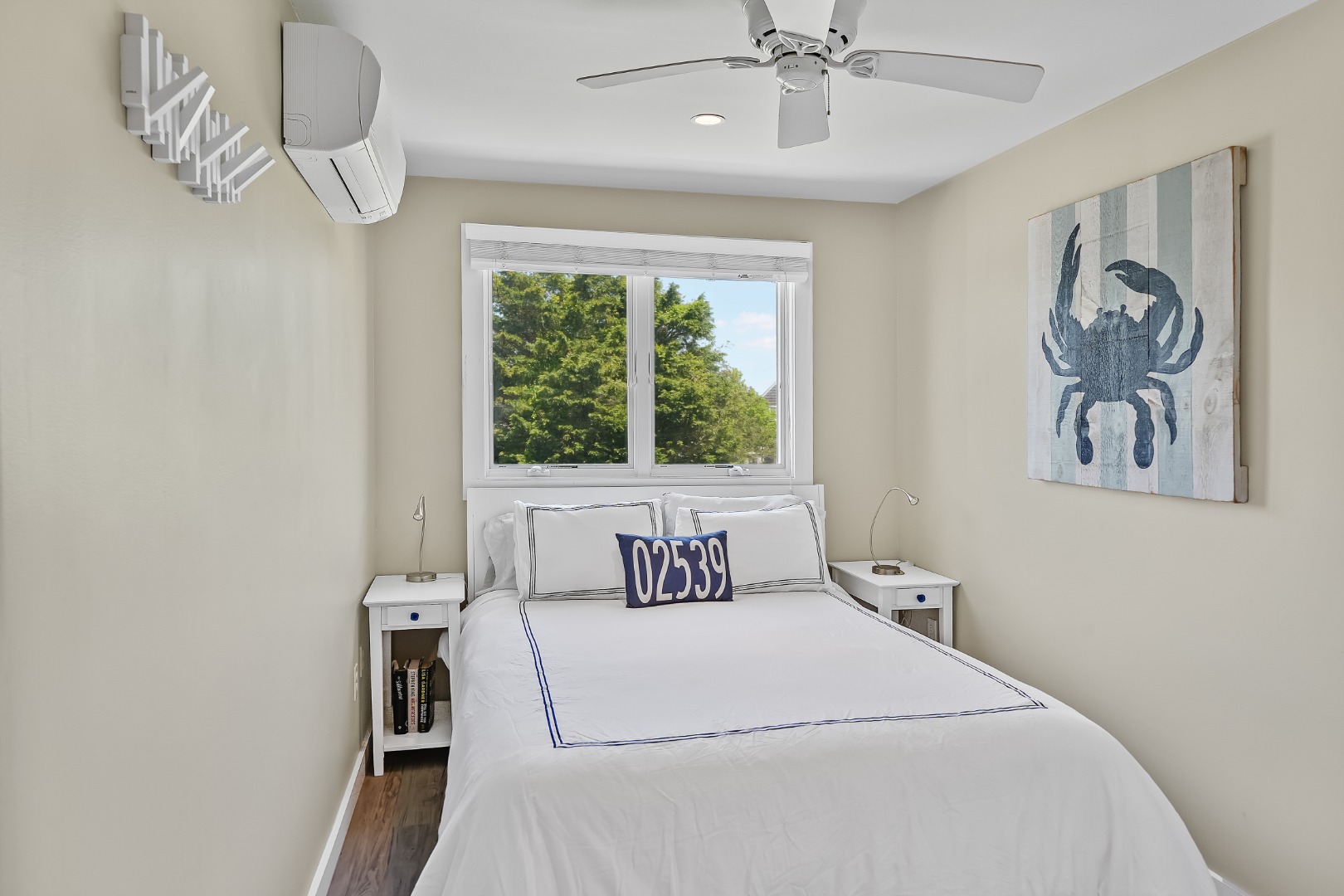 493 Katama Road, Unit E2 Edgartown, MA 02539 - Photo 14 of 29 a bedroom with a bed and a window