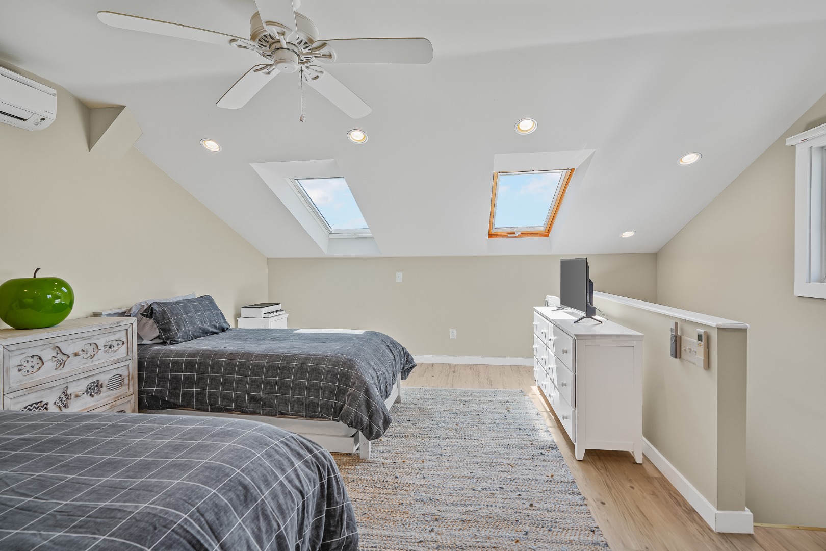 493 Katama Road, Unit E2 Edgartown, MA 02539 - Photo 17 of 29 a bedroom with a large bed and a chandelier
