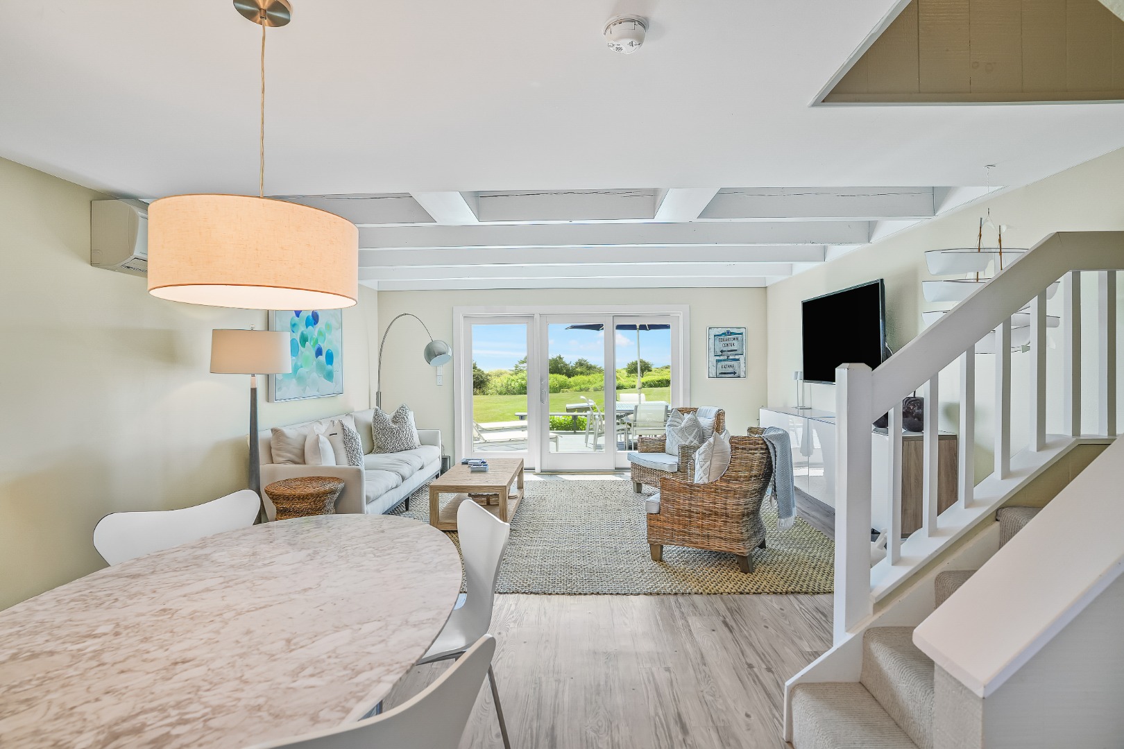 493 Katama Road, Unit E2 Edgartown, MA 02539 - Photo 2 of 29 a living room with furniture fireplace and a flat screen tv