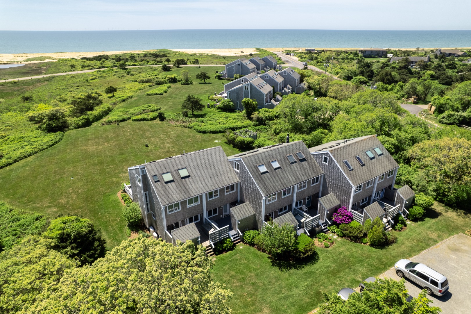 493 Katama Road, Unit E2 Edgartown, MA 02539 - Photo 21 of 29 an aerial view of a house with a garden and lake view