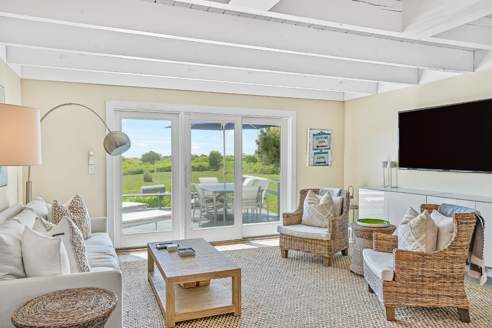 493 Katama Road, Unit E2 Edgartown, MA 02539 - Photo 3 of 29 a living room with furniture and a flat screen tv