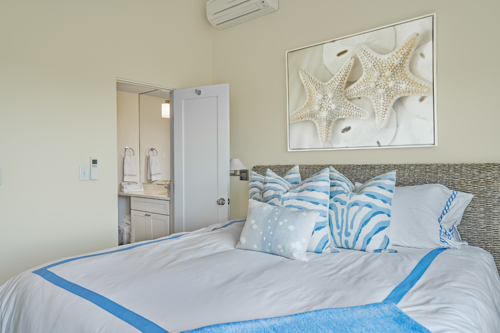 493 Katama Road, Unit E2 Edgartown, MA 02539 - Photo 10 of 29 a bedroom with a bed and painting on the wall