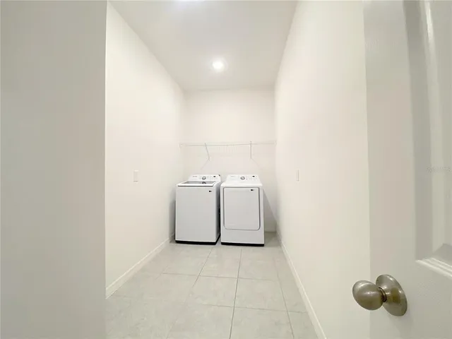 a view of kitchen with cabinets and outdoor space