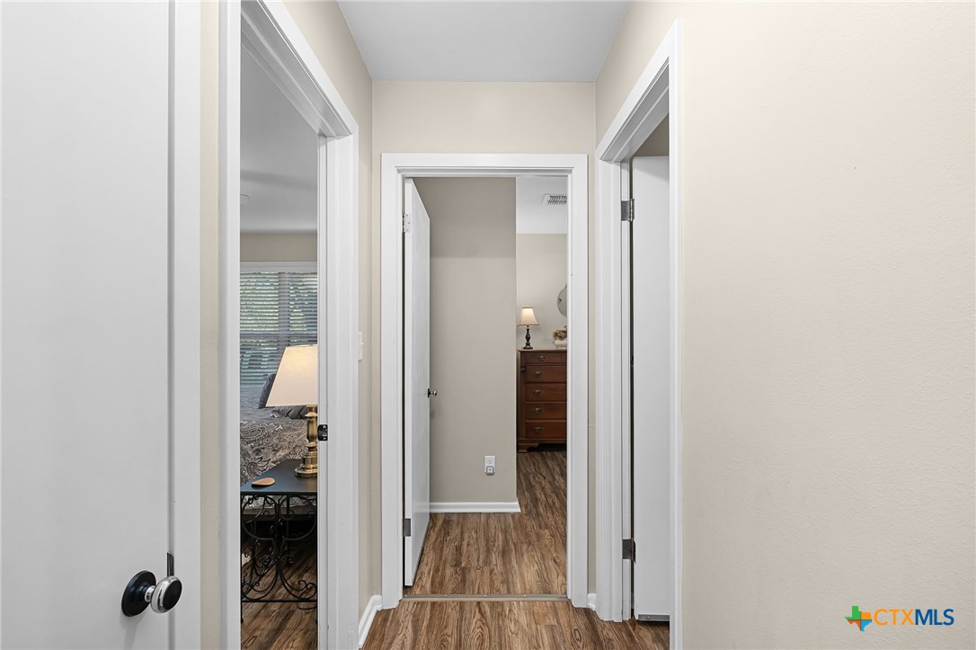 2052 Gruene Road New Braunfels, TX 78130 - Photo 17 of 33 a view of a bathroom from a hallway