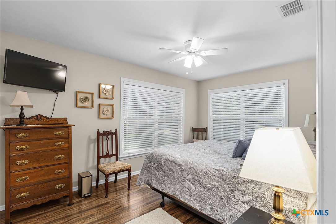 2052 Gruene Road New Braunfels, TX 78130 - Photo 18 of 33 a bedroom with a bed and a flat screen tv